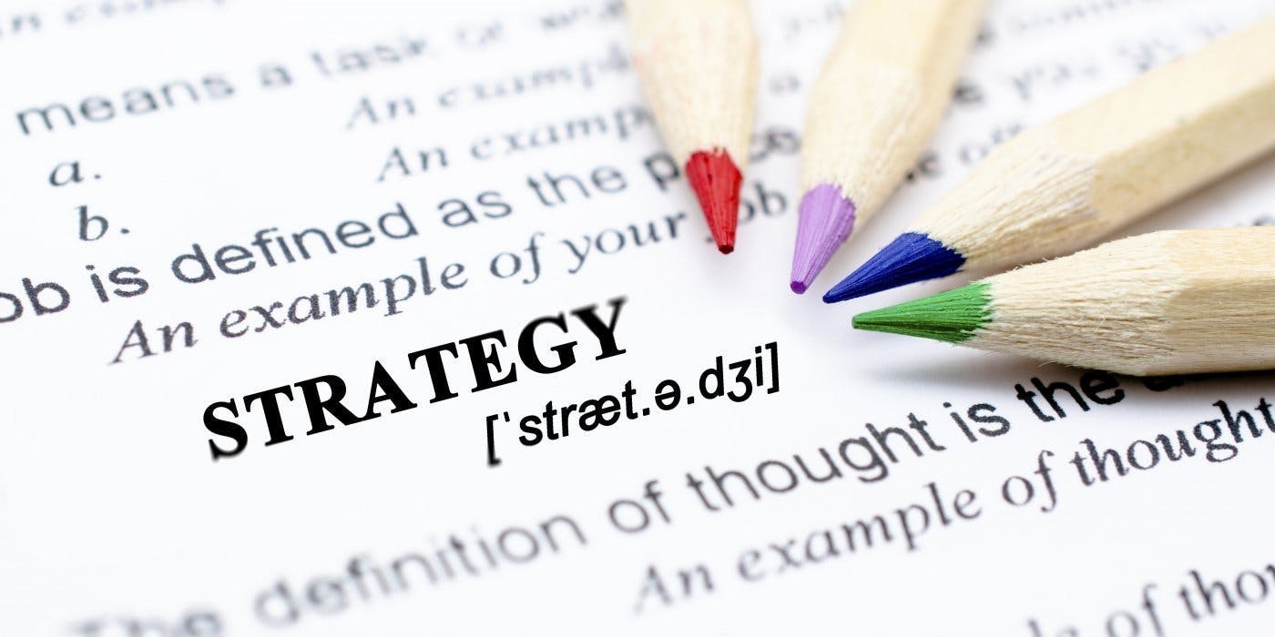 Strategy on paper highlighted by pencils
